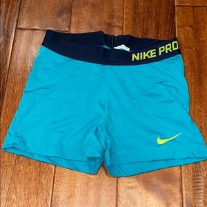 Women’s medium blue/ neon yellow Nike pros